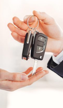 Woman buying the car. Lady in a car salon. Manager with a client